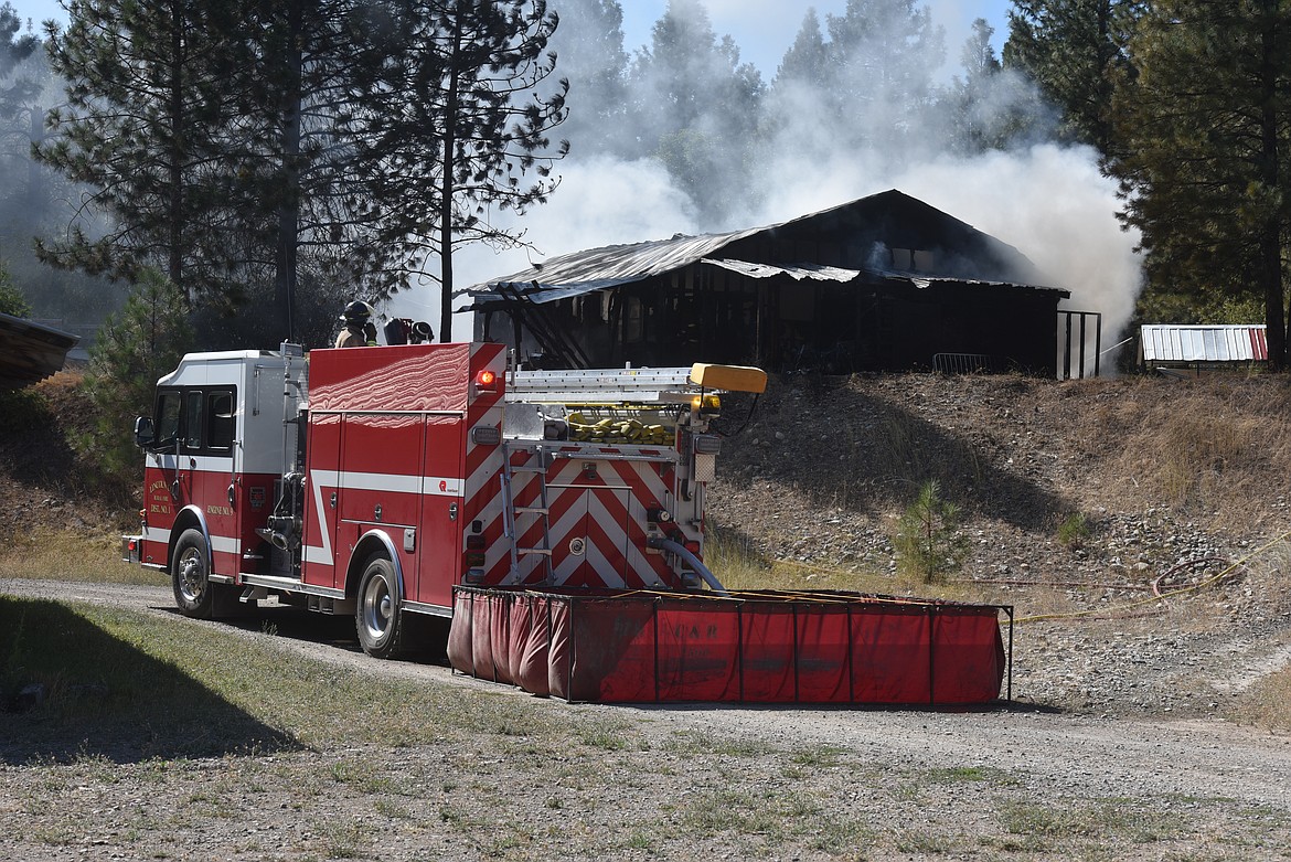 Smoke pours from a garage fire Wednesday afternoon at Echo Lane in Lincoln County. (Scott Shindledecker/The Western News)
