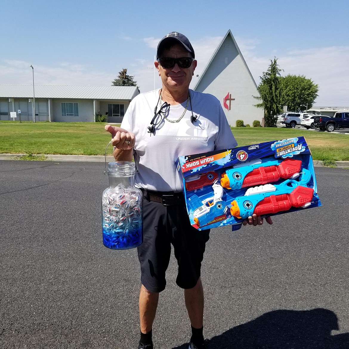 Candy Count winner Leo Dabalos displays his prizes. Dabalos guess was closest to the number of candies in the jar.