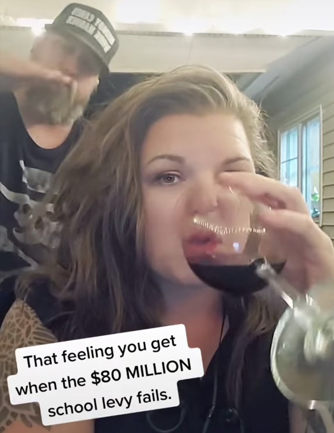 Erin Barnard of the Kootenai County Spectator blog is seen presumably with her husband in this TikTok video, drinking wine and celebrating the failure of the Coeur d'Alene School District's levy election.