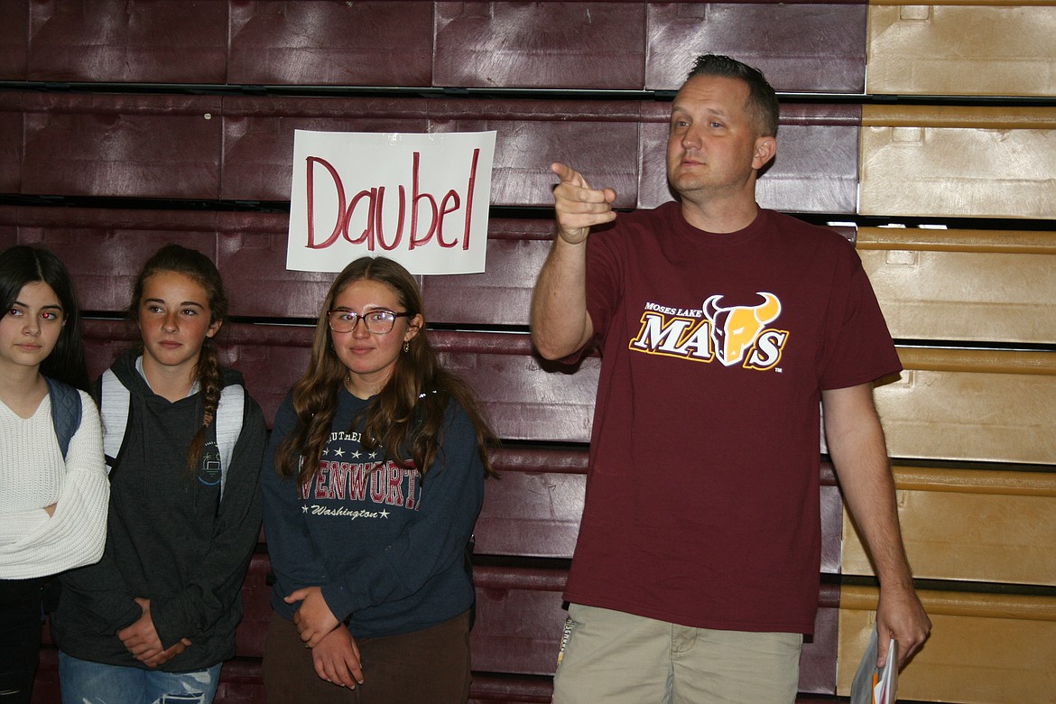 Moses Lake High School teacher Phil Daubel points out the freshmen in his homeroom class during orientation.