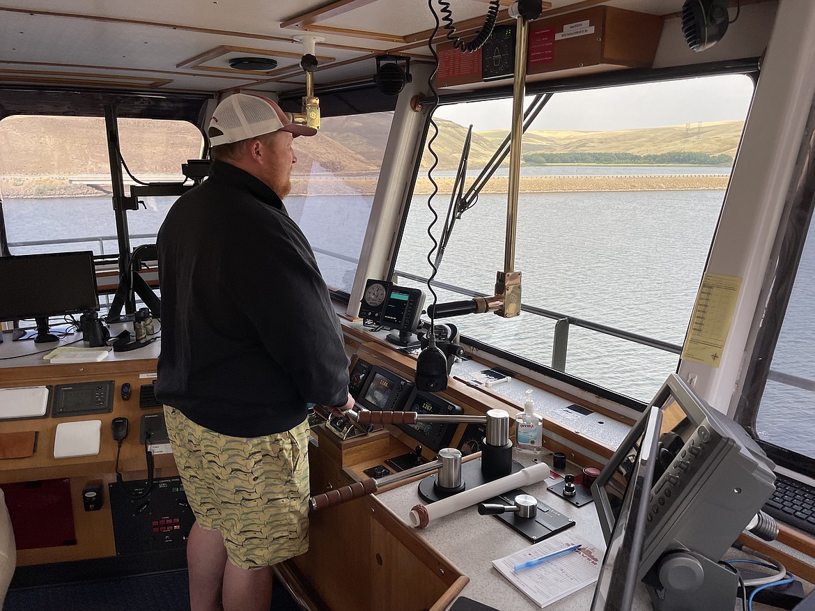 Tugboat captain and pilot Andy Bradley at the controls of the tugboat Lincoln. Even with all the equipment in the wheelhouse to help with navigation, Bradley said nothing beats spending time on the river. “You can’t train experience,” he said.
