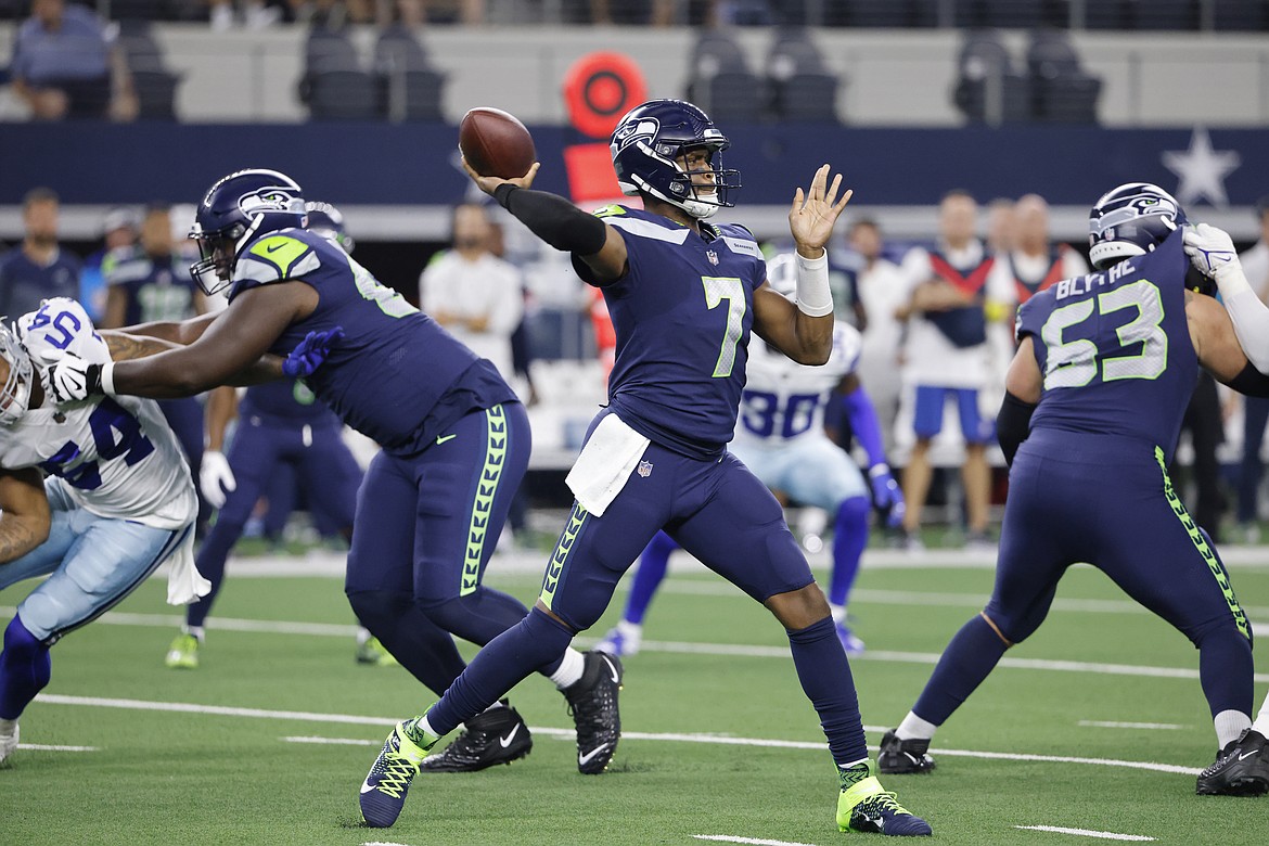 Seattle Seahawks quarterback Geno Smith (7) throws a pass in the first half of a preseason NFL football game against the Seattle Seahawks in Arlington, Texas, Friday, Aug. 26, 2022.