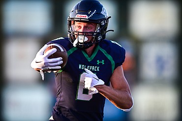 Glacier wide receiver Evan Barnes (8) heads to the end zone on his second of four touchdown receptions against Great Falls CMR at Legends Stadium on Friday, Sept. 2. (Casey Kreider/Daily Inter Lake)