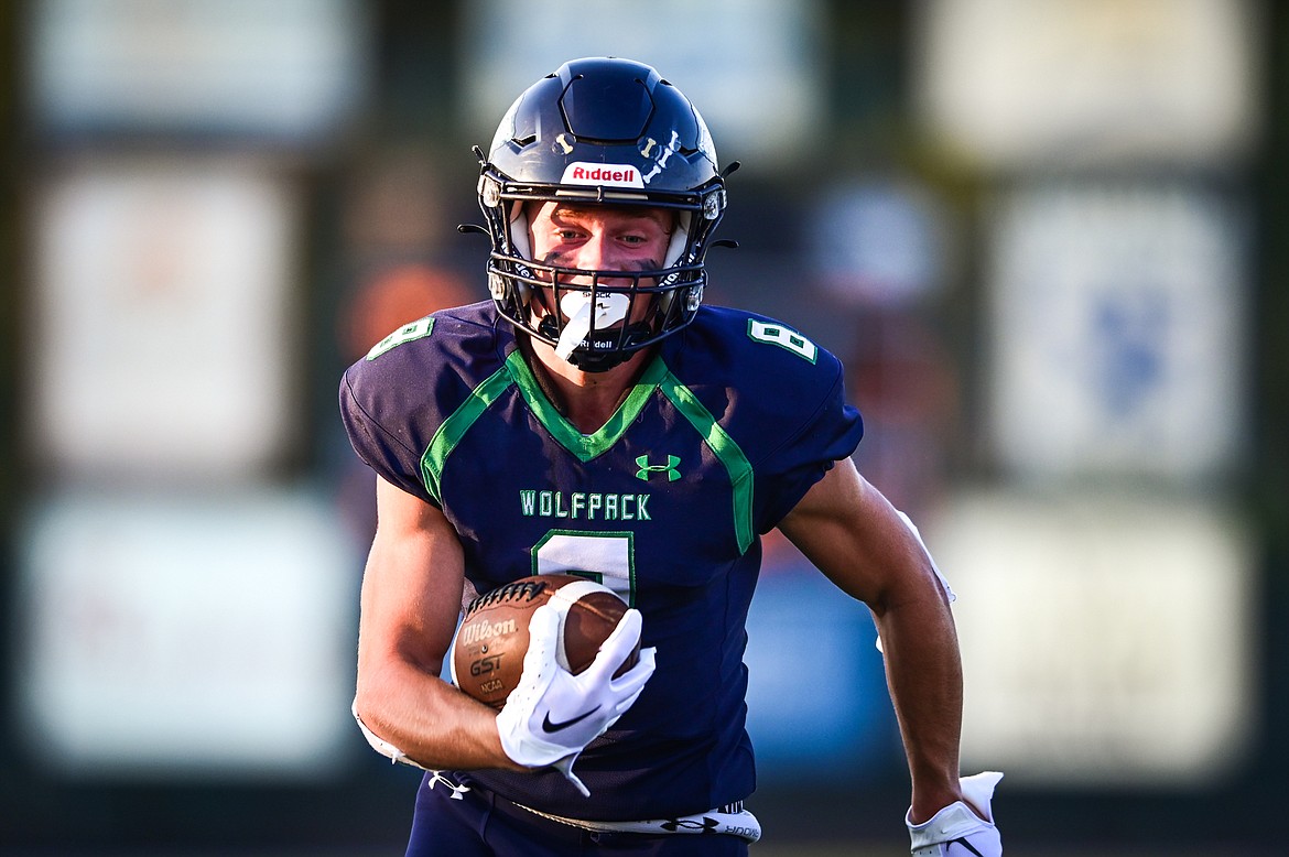 Glacier wide receiver Evan Barnes (8) heads to the end zone on his second of four touchdown receptions against Great Falls CMR at Legends Stadium on Friday, Sept. 2. (Casey Kreider/Daily Inter Lake)