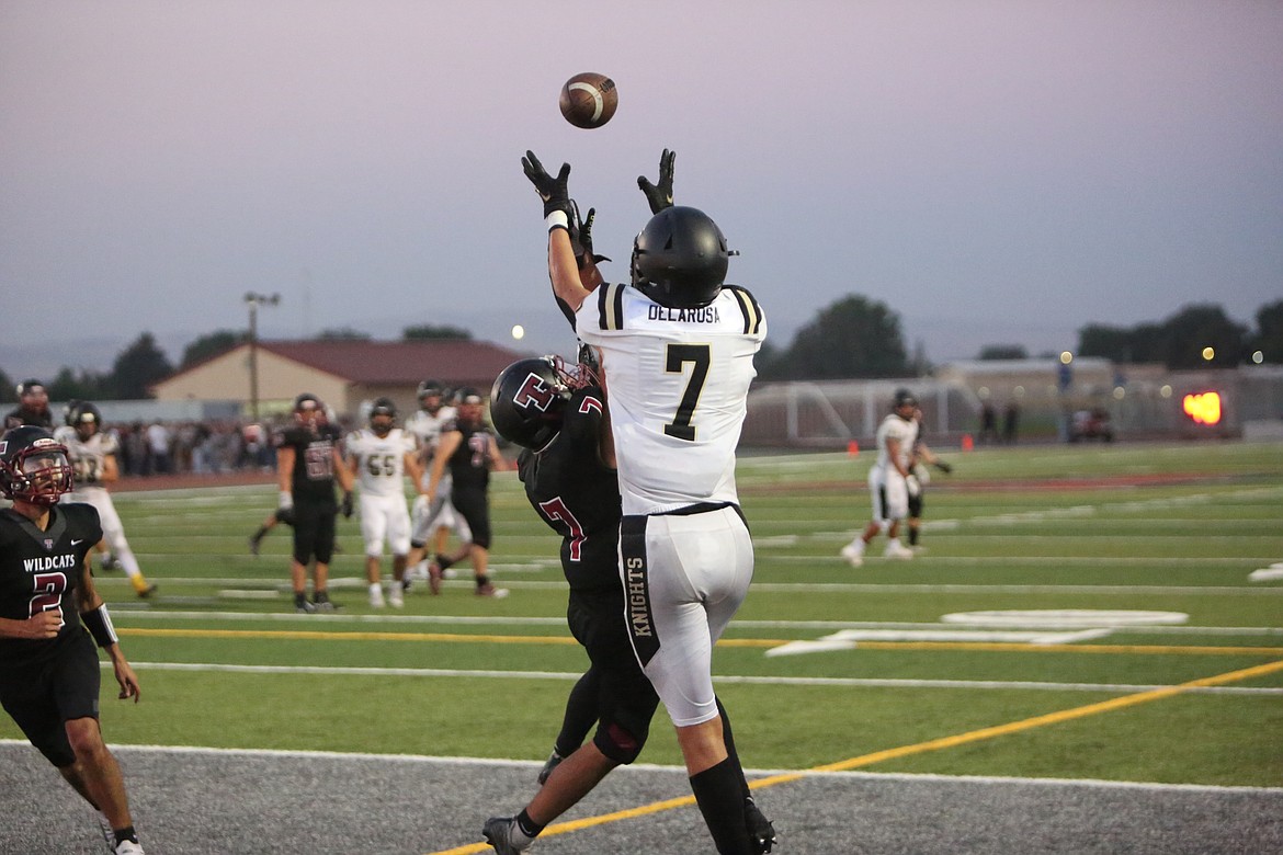 Wide receiver Edgar Delarosa reaches over a Toppenish defender for his second of three touchdown catches in the 34-6 win.