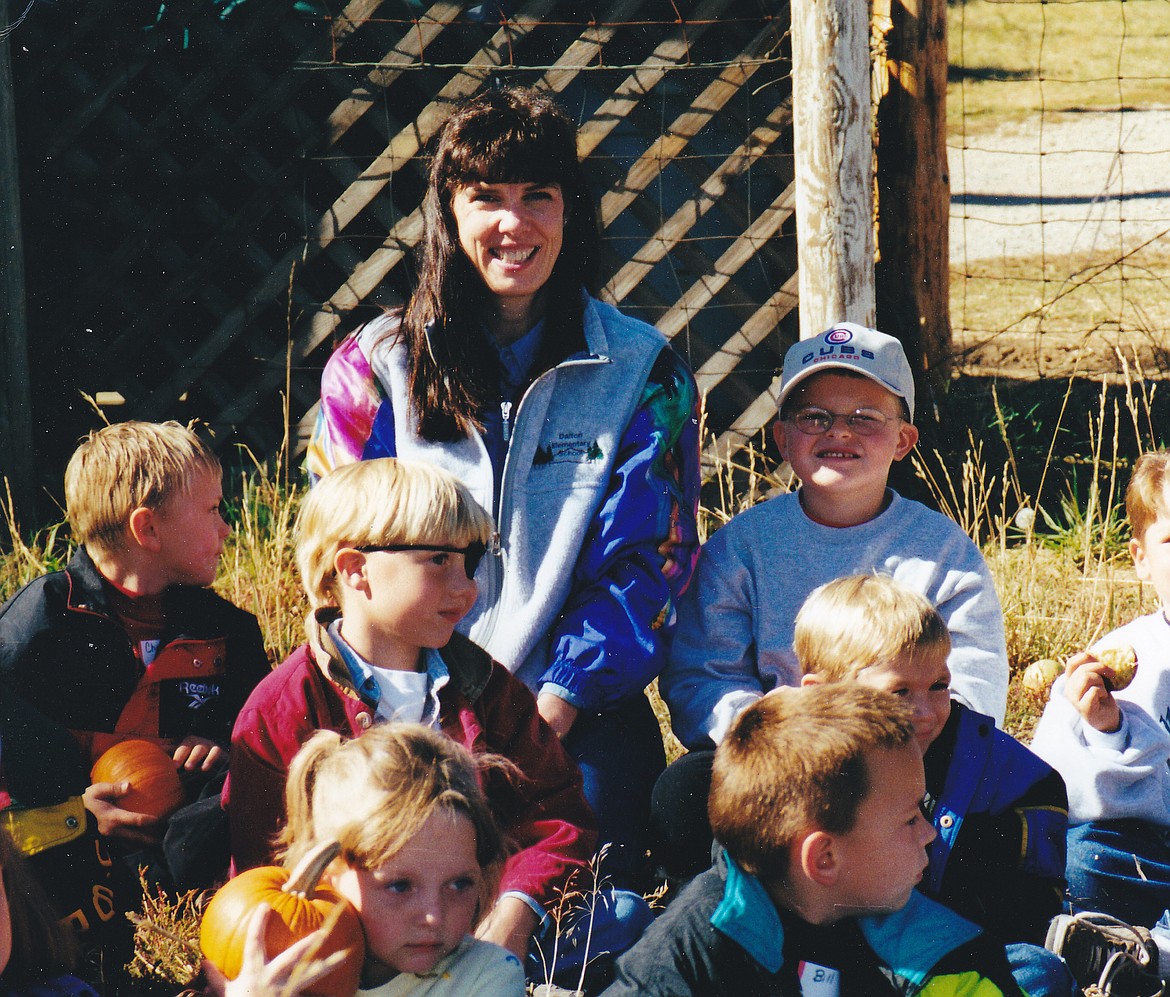 First-grade teacher Nancy Nuttelman is pictured on a past Green Bluff field trip with her students. Nuttelman just retired from the Coeur d'Alene School District after four decades.