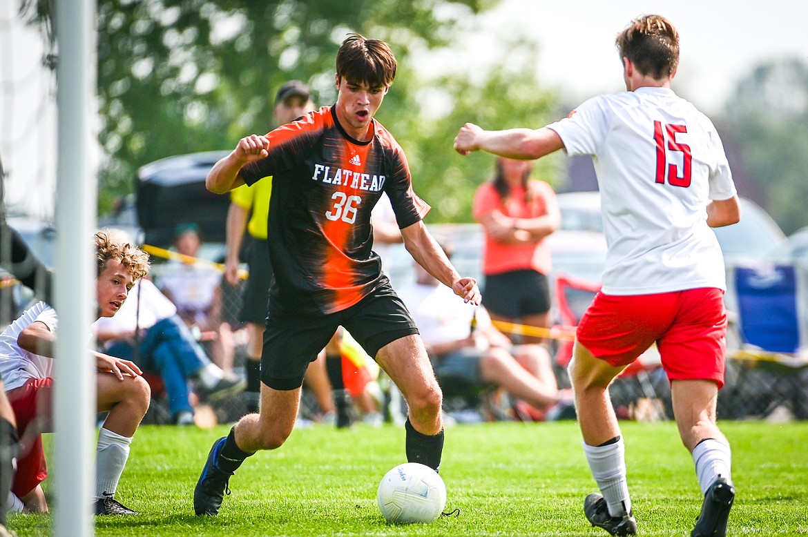 Flathead's Carter Bullins (36) works the ball into the box in the first half against Missoula Hellgate at Kidsports Complex on Saturday, Sept. 3. (Casey Kreider/Daily Inter Lake)