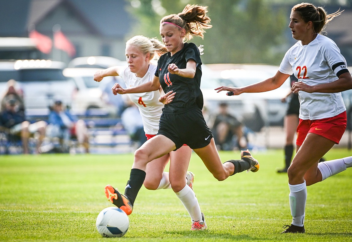 Flathead's Mia Stephan (11) scores a goal in the first half against Missoula Hellgate at Kidsports Complex on Saturday, Sept. 3. (Casey Kreider/Daily Inter Lake)