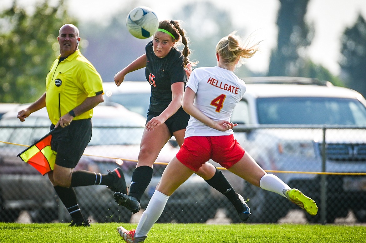 Flathead's Fiona Coulter (15) centers a ball past MIssoula Hellgate defender Jaden Lumpkin (4) in the first half at Kidsports Complex on Saturday, Sept. 3. (Casey Kreider/Daily Inter Lake)