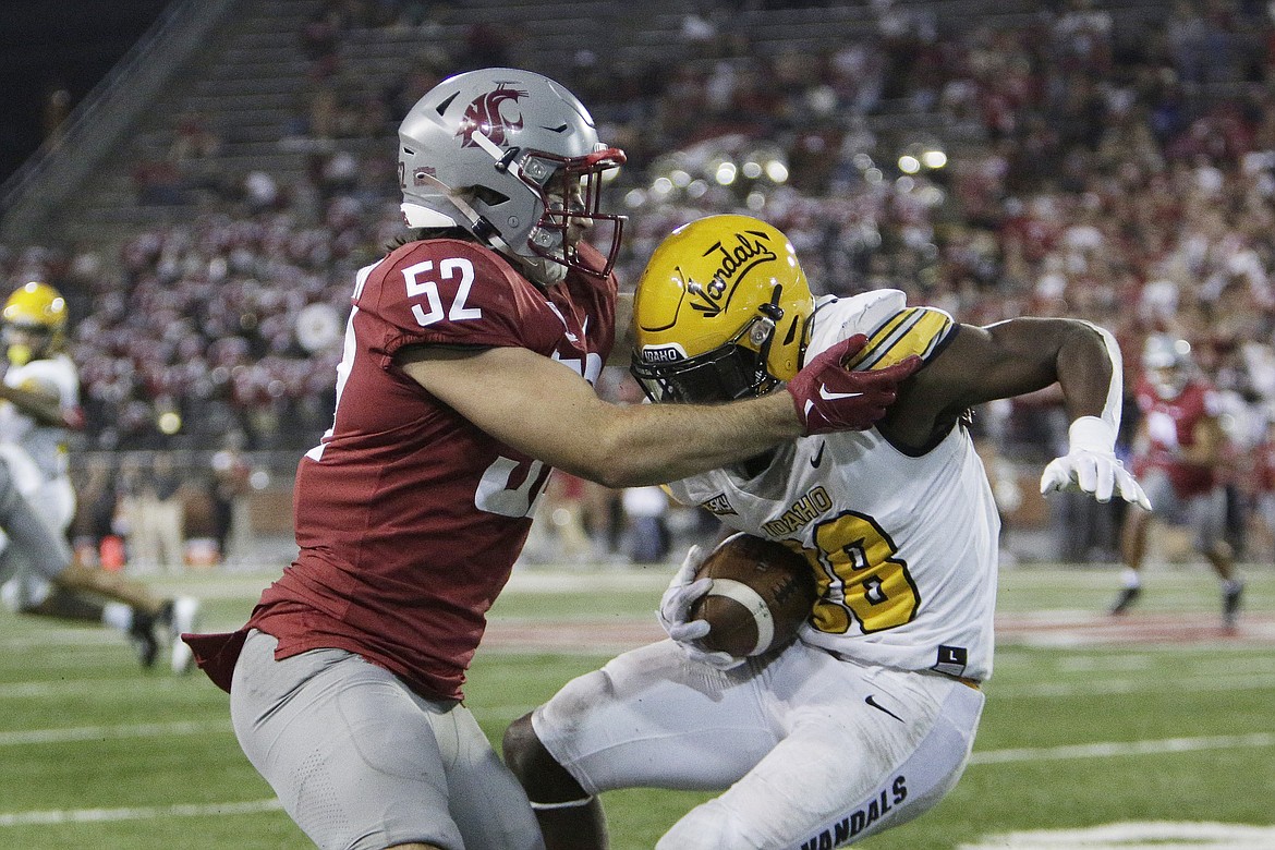 YOUNG KWAK/Associated Press
Washington State linebacker Kyle Thornton tackles Idaho running back Anthony Woods during the second half of Saturday's game in Pullman.