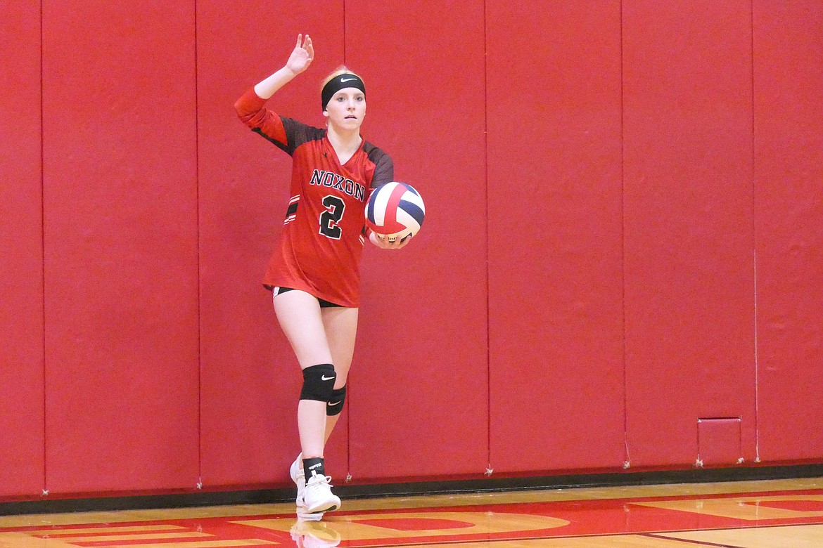 Noxon senior Aubry Erwin lines up a serve in the first game of the Red Devils' match with Hot Springs last Tuesday.  Noxon won, 3-1.  (Chuck Bandel/VP-MI)