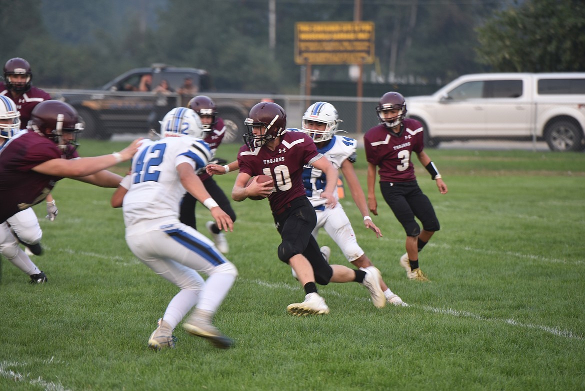 Troy Trojan Trevor Grant looks for room to run against the Mission Bulldogs Friday, Sept. 2. (Scott Shindledecker/The Western News)