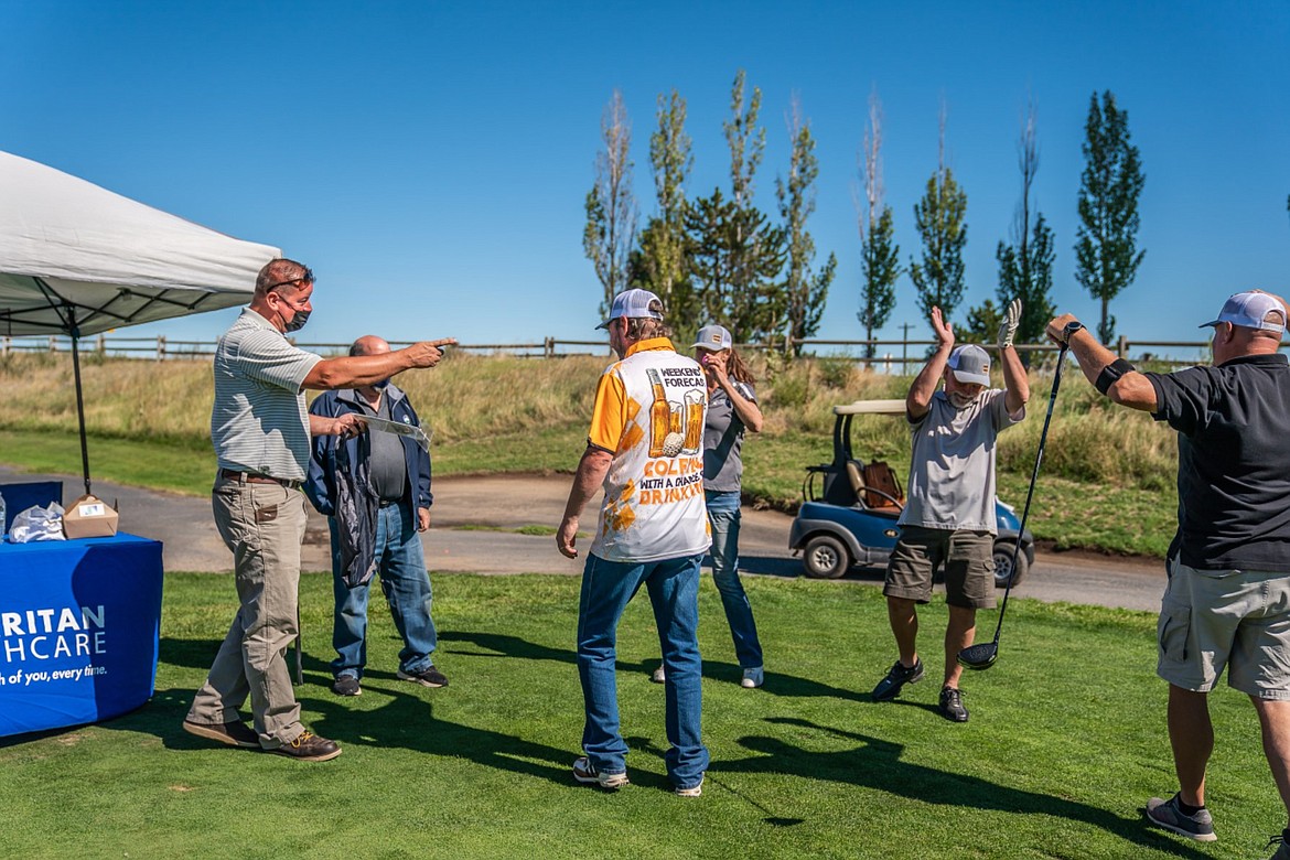 Golfers can play in side games during the 21st annual Desert Golf Classic, as shown by these players in 2021.