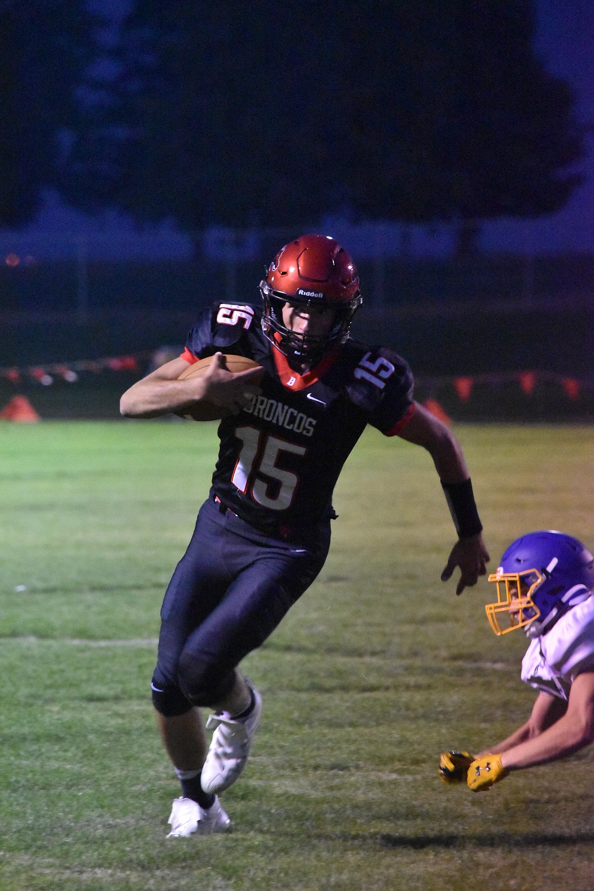 Broncos senior quarterback Chase Galbreath, 15, rushes the ball during the game against Colfax on Sept. 2.