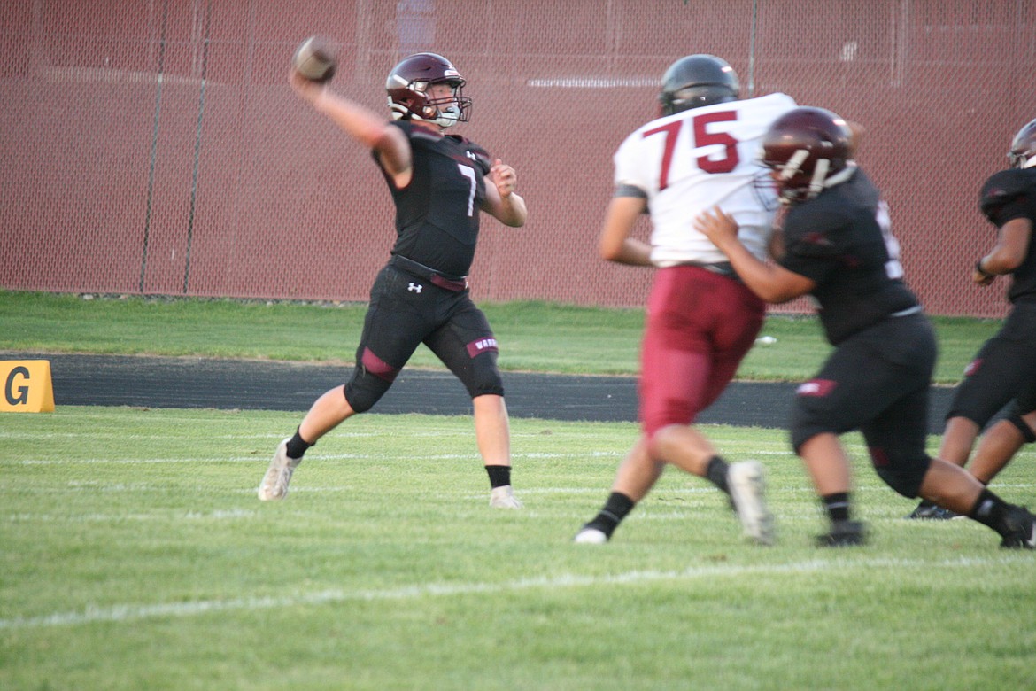 Wahluke quarterback Andrew Yorgesen, 7, goes back to pass during Friday’s game against Grandview.