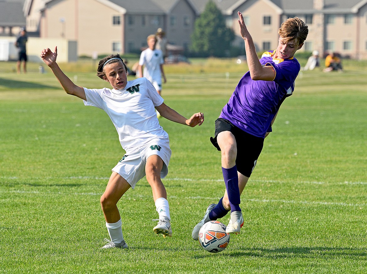 Whitefish's Logan Bingham challenges a Livingston defender during a game at Smith Fields on Friday. (Whitney England/Whitefish Pilot)