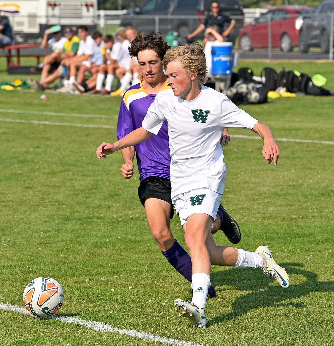 Bulldog Griffin Gunlikson beats a Livingston defender and looks to cross the ball into the box during a game at Smith Fields on Friday. (Whitney England/Whitefish Pilot)