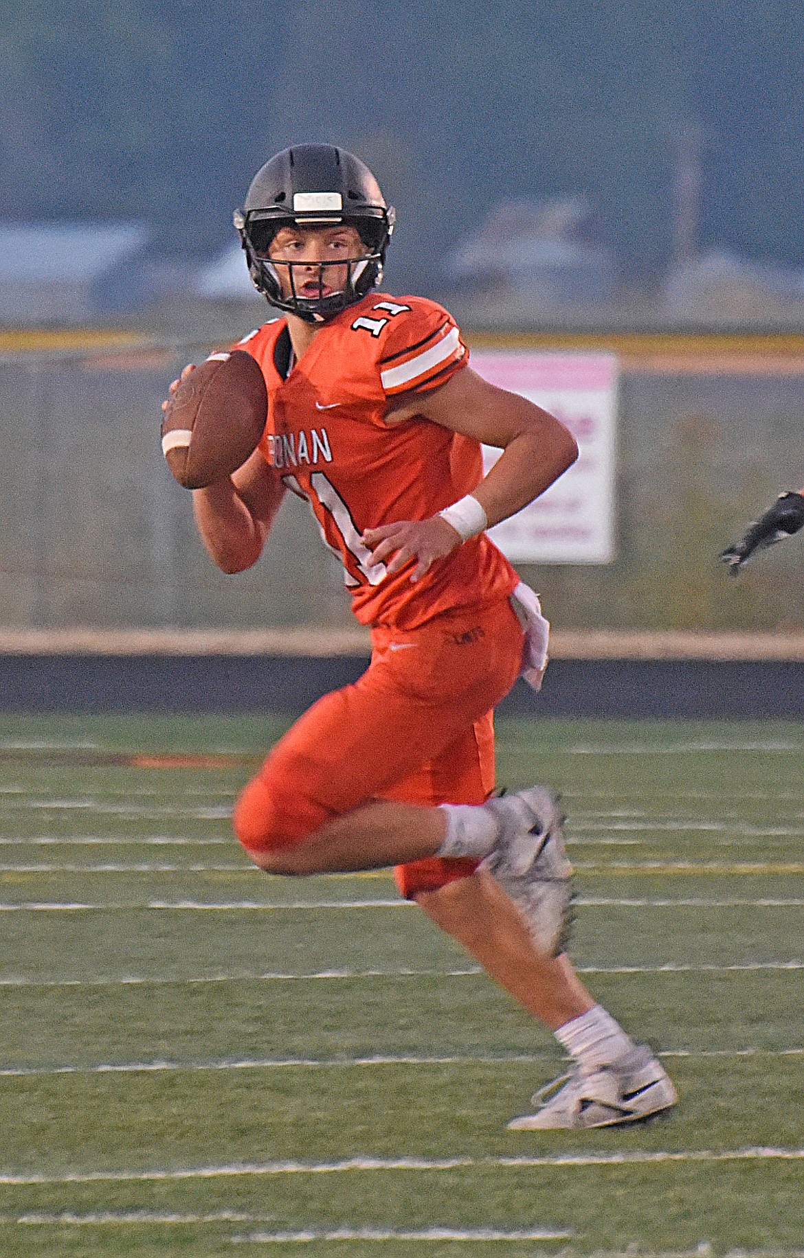 Ronan Chief quarterback Caleb Cheff searches down field for an open receiver. (Marla Hall/Lake County Leader)