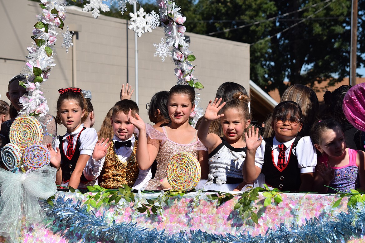 Parade participants wave to the crowd at the 2021 Farmer Consumer Awareness Day parade. The 2022 FCAD will be Saturday.