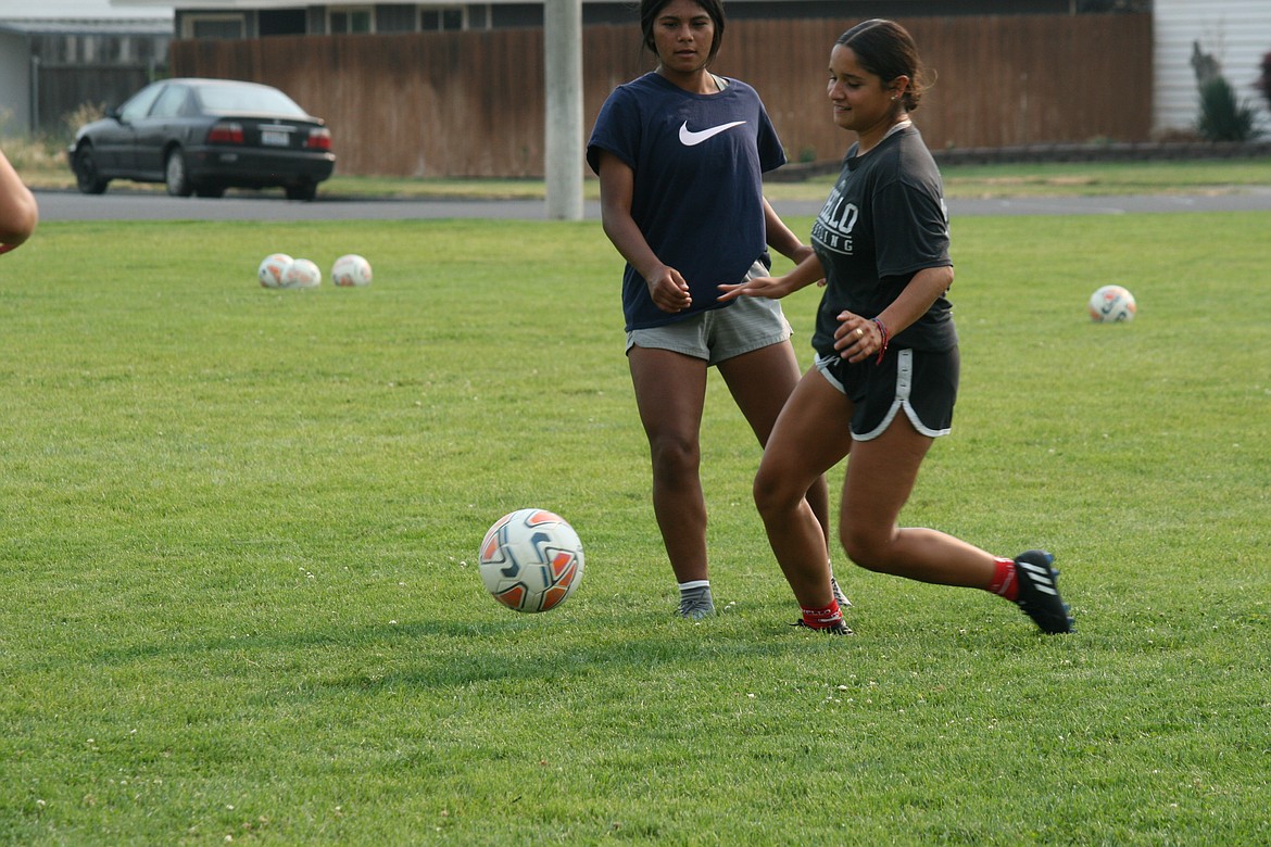 Ruby Trinidad advances the ball during Othello High School girls soccer practice Friday. Coach Juan Garcia said the goal for 2022 is to build on the successful 2021 season.