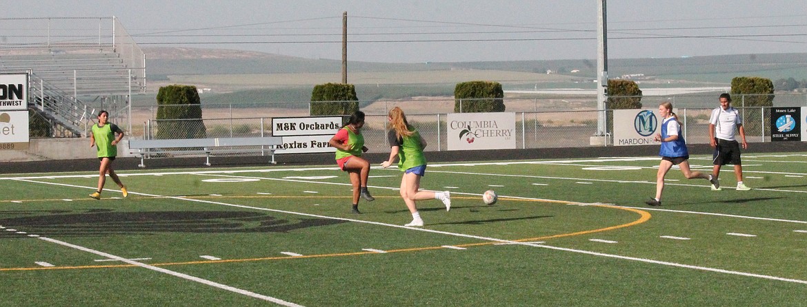 Royal High School girls soccer players practice Thursday. The team was knocked out of the first round at state last year, said Head Coach Jens Jensen, and they’re hoping to get farther this year.