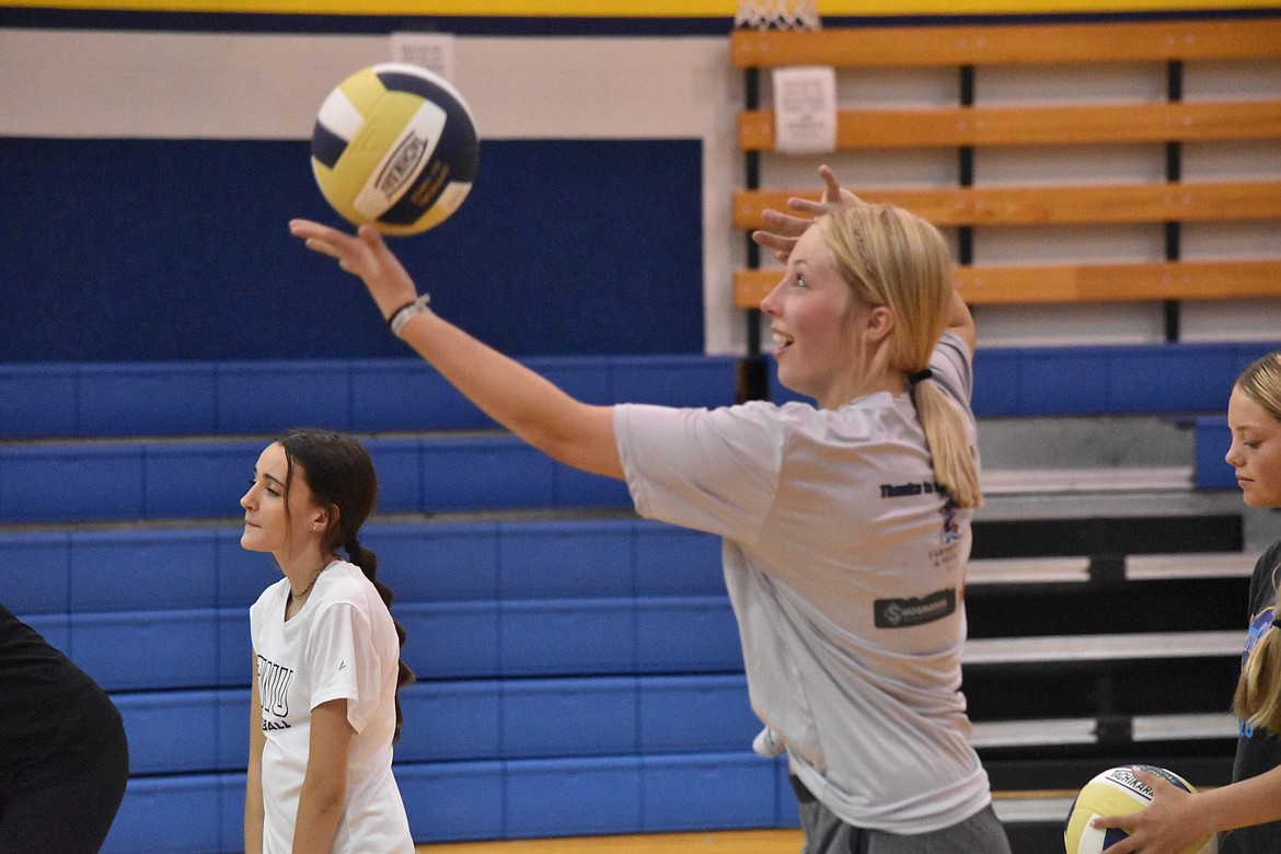 New Wilson Creek volleyball coach Christa Christopherson said her expectations of the team are: attitude, talk and effort. Hannah Smith practices serving.