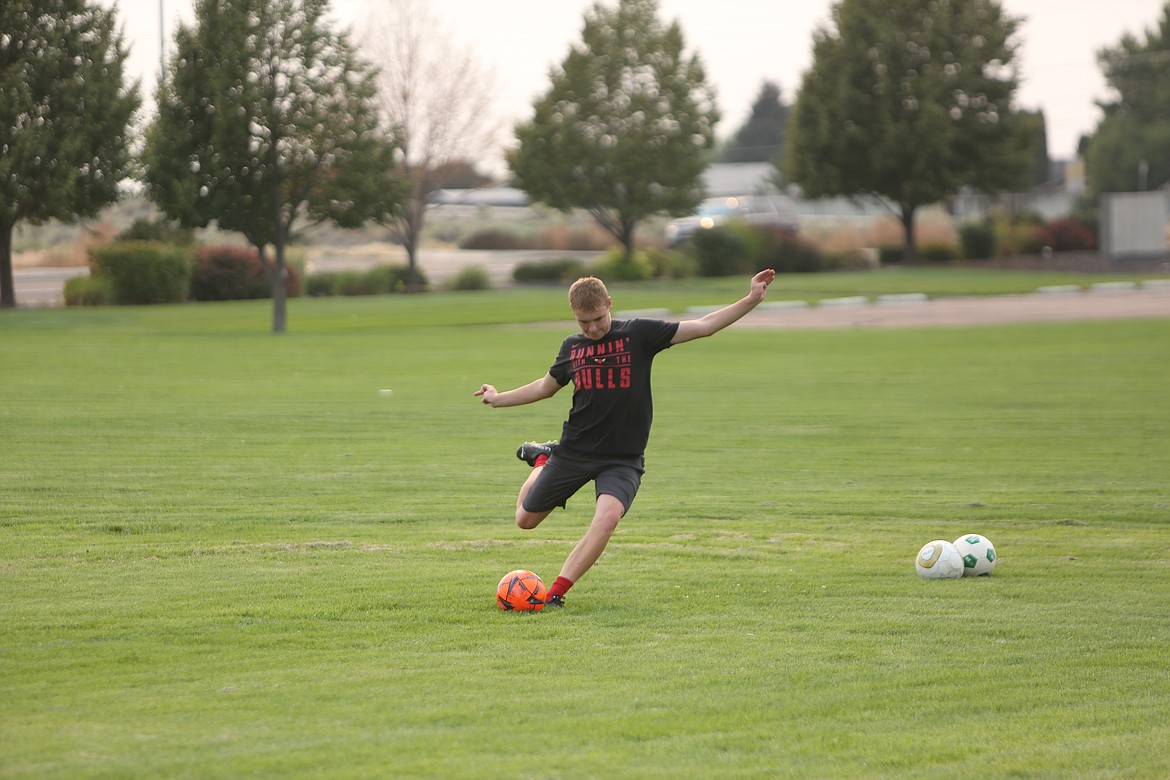 MLCA/CCS’s James Robertson swings on a corner kick during practice on Sept. 2, 2022.