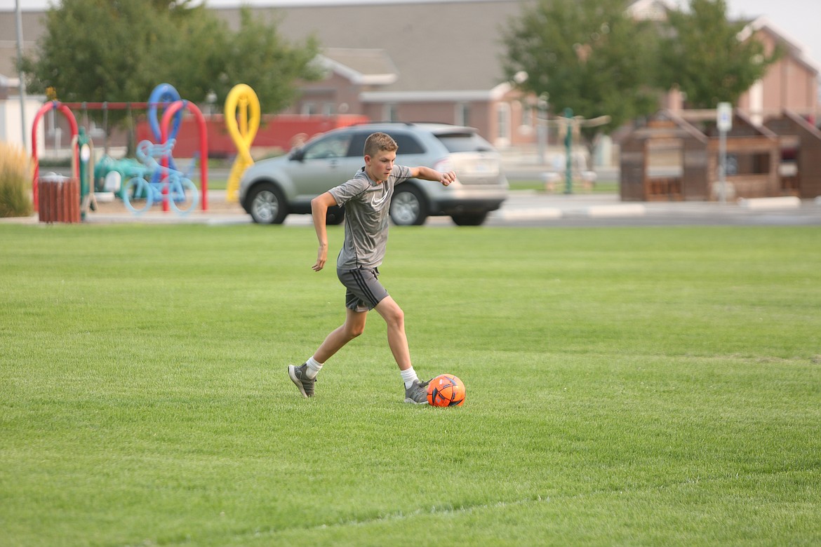 Treyson Kast moves the ball upfield during practice.