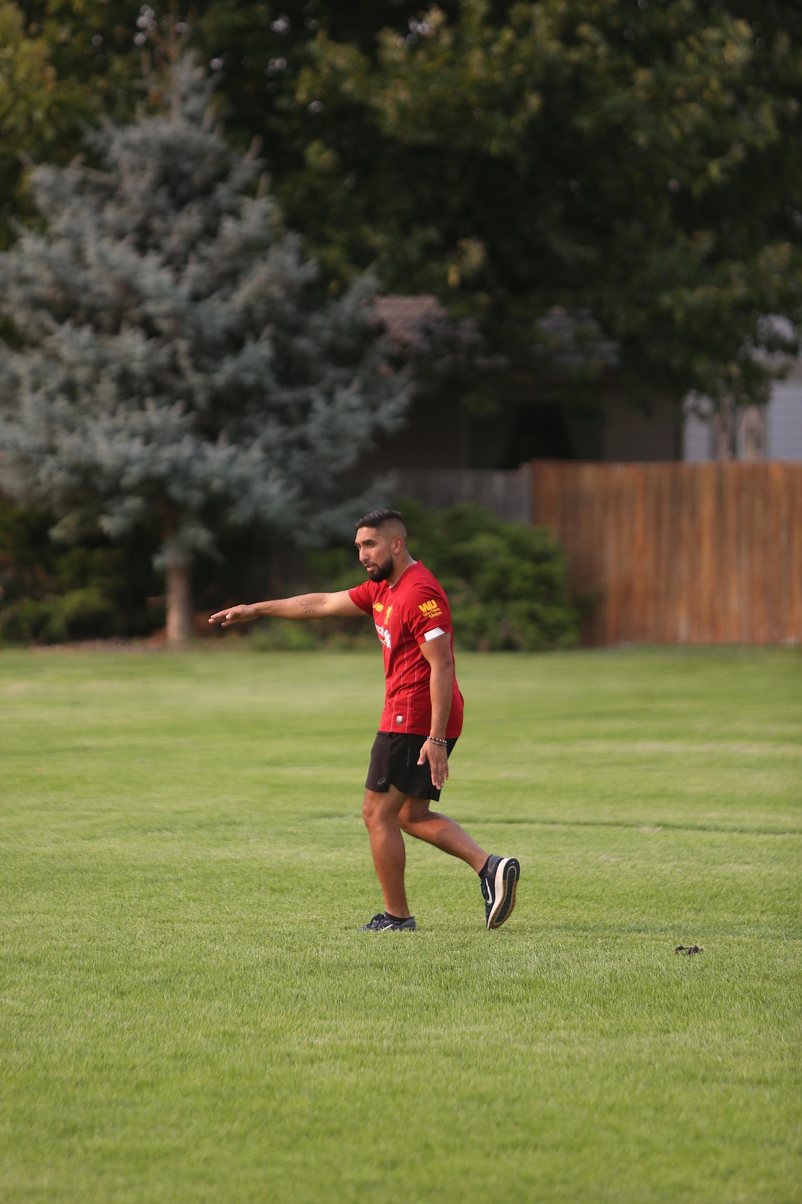 MLCA/CCS boys soccer head coach Shaq Ledezma demonstrates a drill during practice.