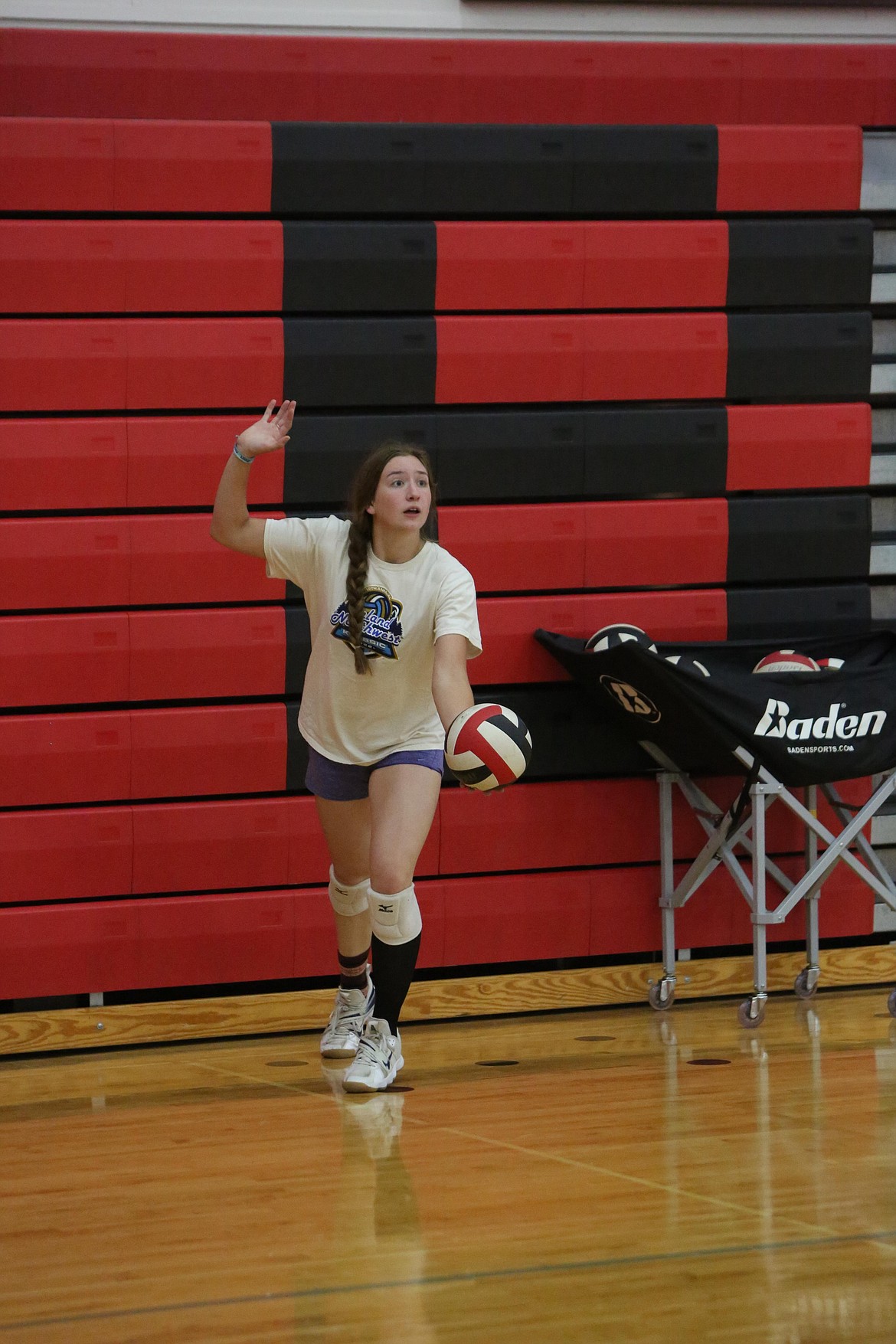 Senior Taylor Galbreath raises her arm to begin a serve.