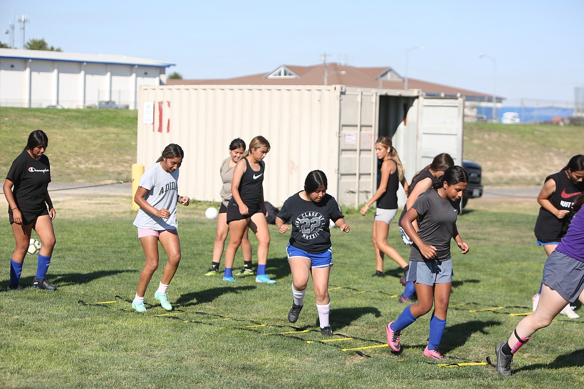 The Cougars move on to work on ladder drills to improve agility.