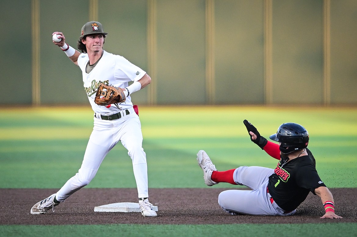 Glacier second baseman Ryan Cash (5) throws to first in an attempt to turn a double play in the second inning against the Great Falls Voyagers at Flathead Field on Wednesday, Sept. 7. (Casey Kreider/Daily Inter Lake)