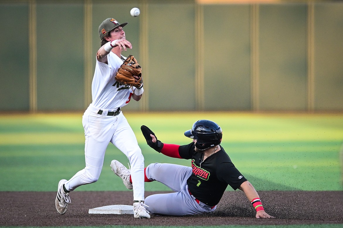 Glacier second baseman Ryan Cash (5) throws to first in an attempt to turn a double play in the second inning against the Great Falls Voyagers at Flathead Field on Wednesday, Sept. 7. (Casey Kreider/Daily Inter Lake)