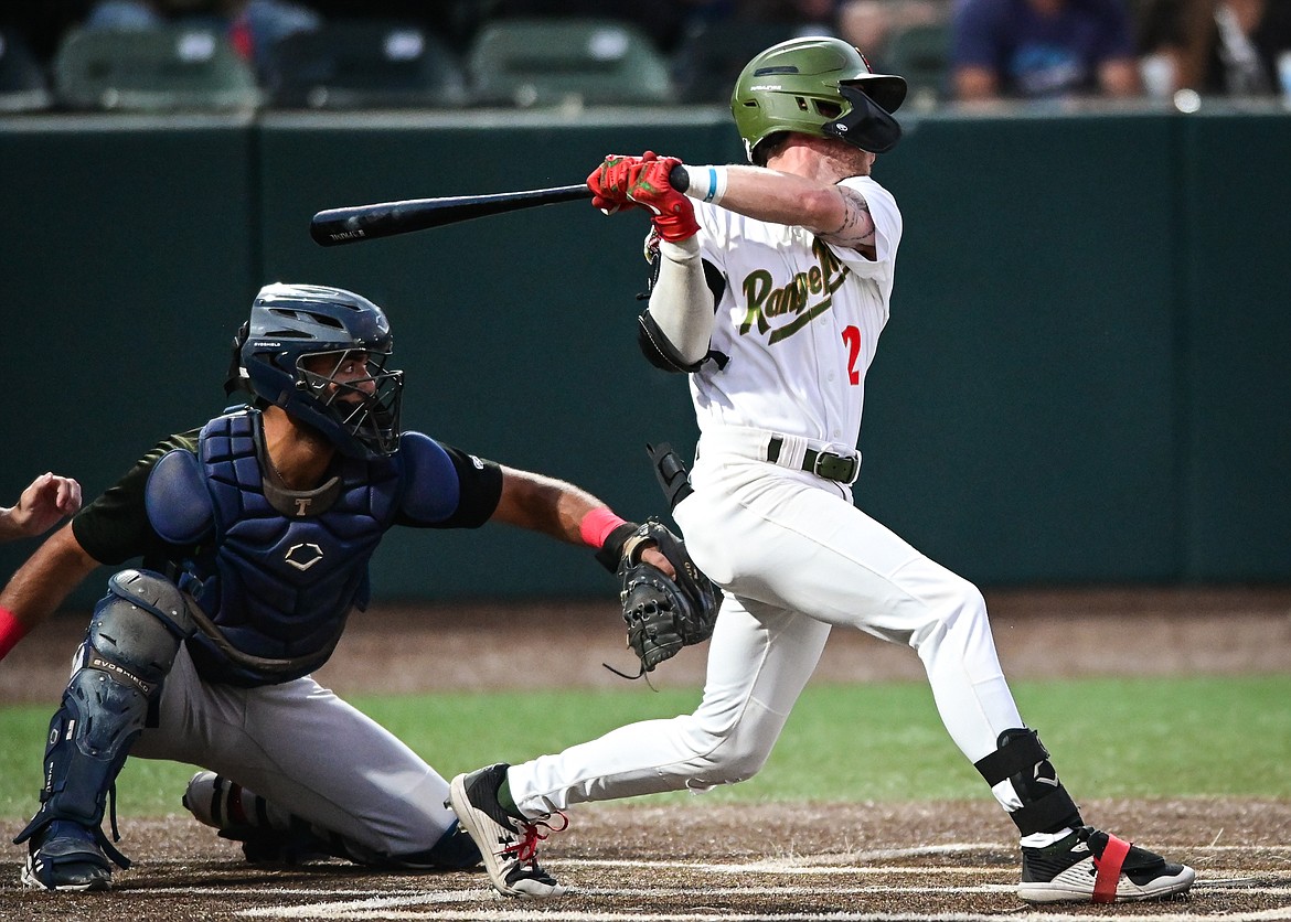 Glacier's Ben McConnell (2) drives in two runs with a double in the third inning against the Great Falls Voyagers at Flathead Field on Wednesday, Sept. 7. (Casey Kreider/Daily Inter Lake)