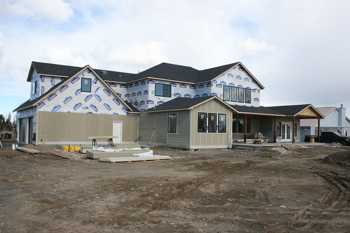 A home under construction south of Moses Lake in spring 2021. Building activity in Grant County has slowed slightly, but there’s still a lot going on.