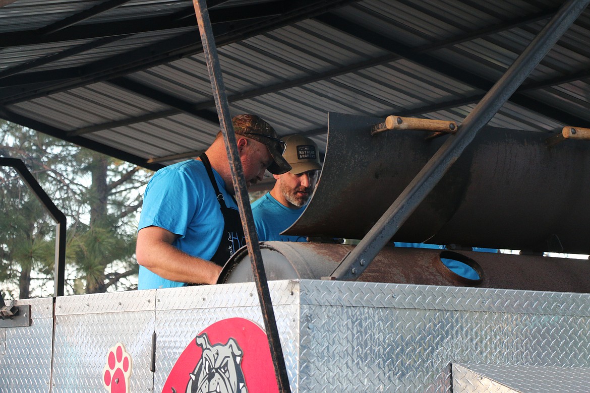 Organizers man the grill at Sunday's Walk for HOPE barbecue.