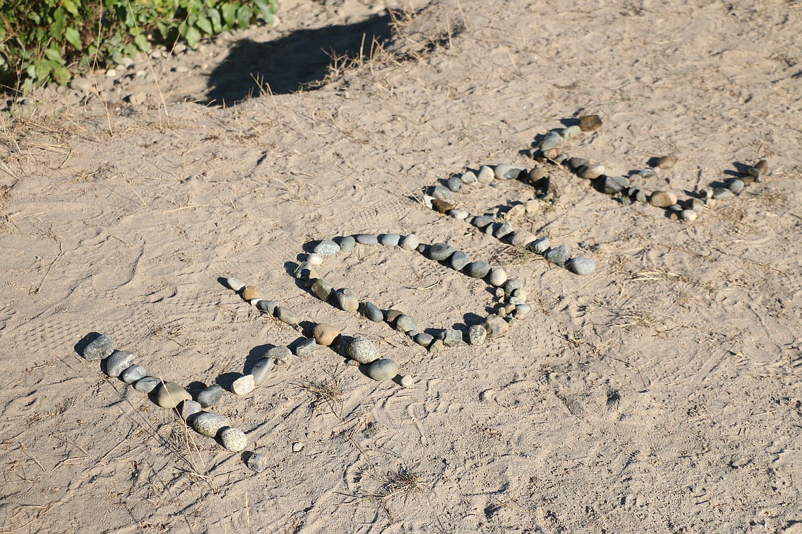 A message of hope was created using rocks found at Dog Beach at the start of the 2022 Walk for HOPE.