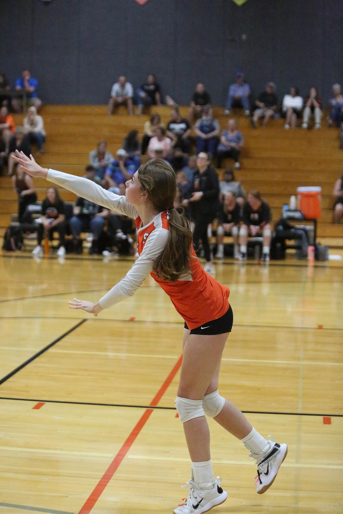 Ephrata senior Halee Moore serves the ball during the third set. Ephrata head coach Britney MacLeod praised Moore for her passing skills that help the team offensively.