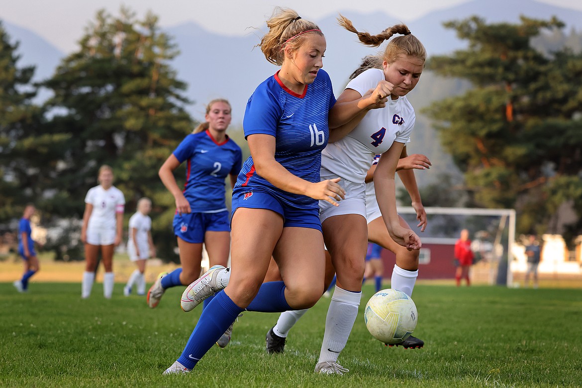 Bigfork midfielder Scout Nadeau fights for possession of the ball against Columbia Falls defender Brenna Ruggiero in the Valkyries 3-1 win at home Thursday, Sept. 8. (Jeremy Weber/Daily Inter Lake)