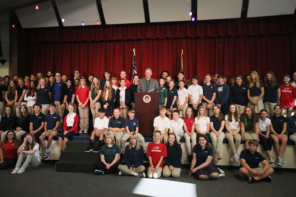 Idaho Gov. Brad Little snaps a group photo with eighth-through-12th graders in Coeur d'Alene Charter Academy after announcing Empowering Parents program news Thursday morning.
