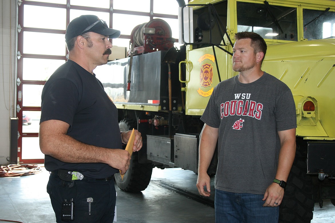 Matt Hyndman, left, Grant County Fire District 8 chief, talks with vendor - and former GCFD 8 firefighter - Matt Jamison at the station. The station has six paid firefighters and about 20 volunteers.