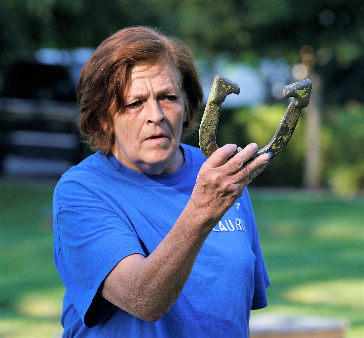 Laurie Dale of Athol eyes the stake before throwing a horseshoe during practice on Thursday at Winton Park.