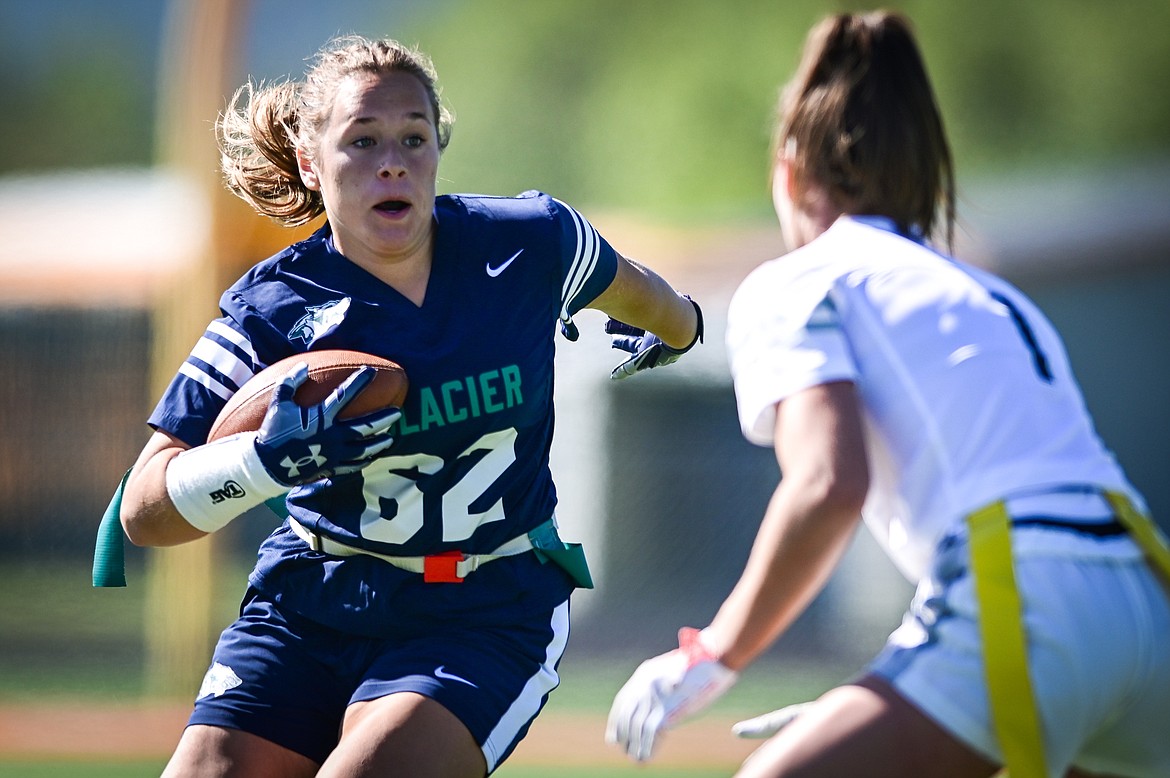 Glacier's Alli Buls (62) tries to get past Flathead's Peyton Walker (1) after a reception at Legends Stadium on Saturday, Sept. 10. (Casey Kreider/Daily Inter Lake)