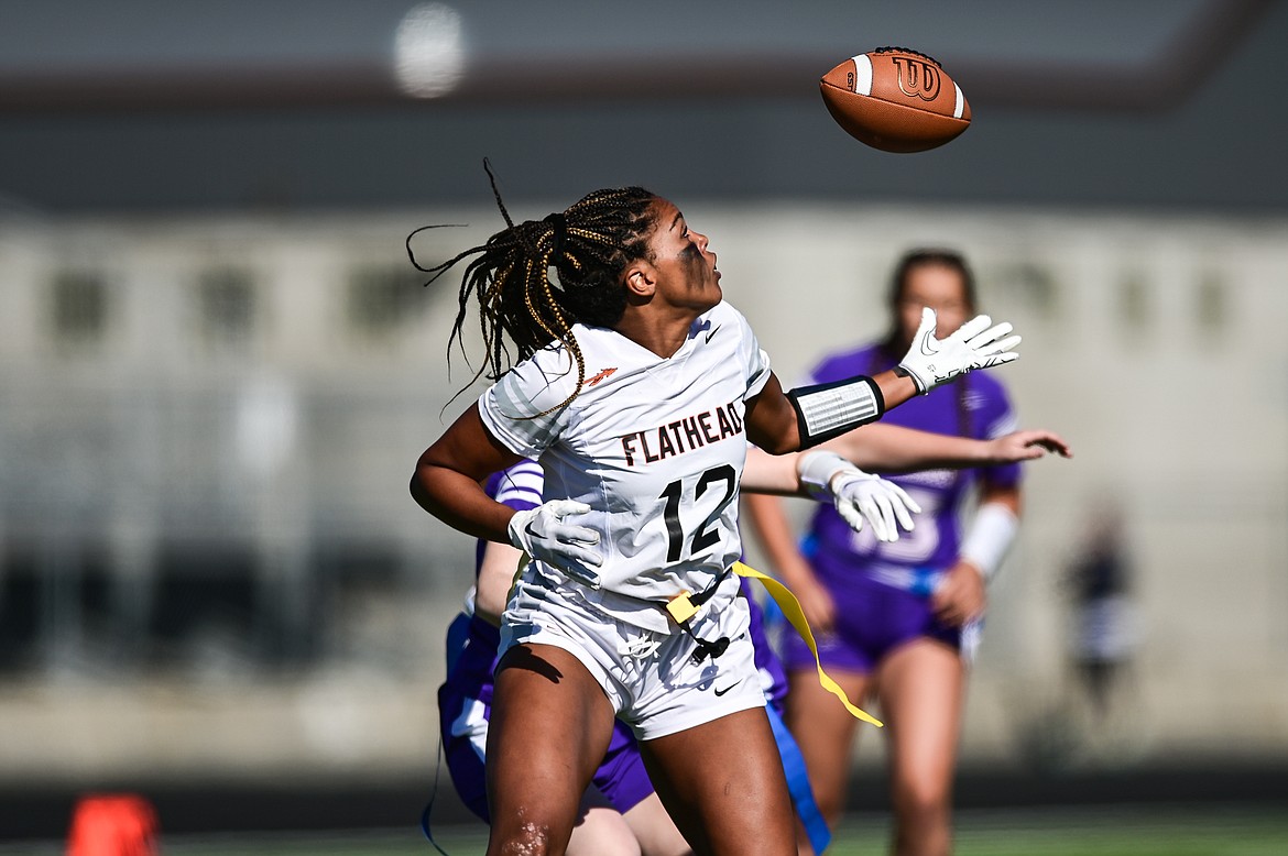 Flathead receiver Akilah Kubi (12) tips a pass into the air and makes the reception against Butte at Legends Stadium on Saturday, Sept. 10. (Casey Kreider/Daily Inter Lake)