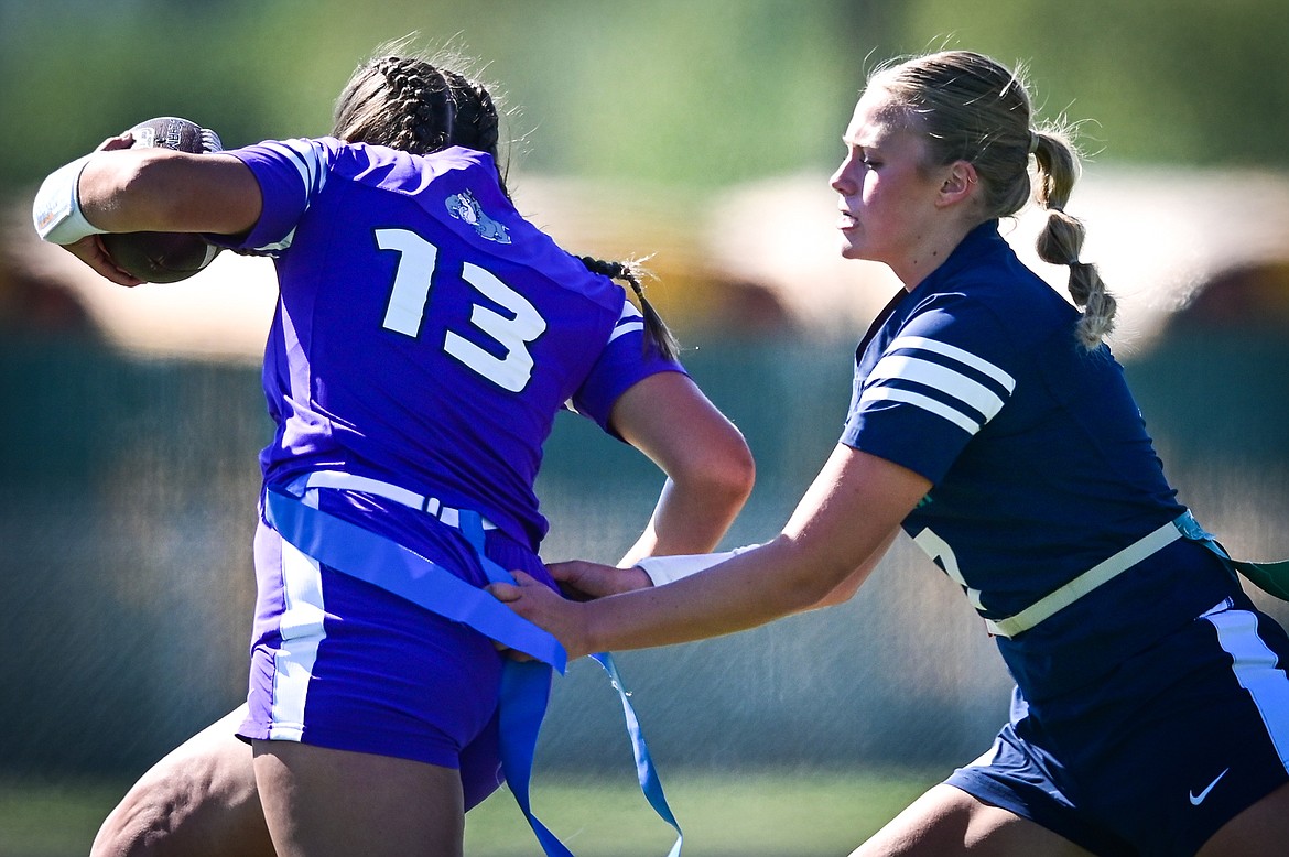 Glacier's Abby Weber (7) tackles Butte's Hayla Hoffman (13) at Legends Stadium on Saturday, Sept. 10. (Casey Kreider/Daily Inter Lake)