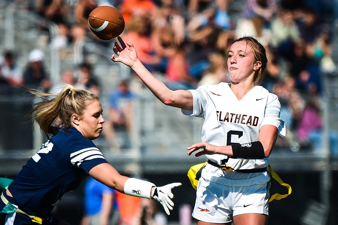 Flathead quarterback Harlie Roth (6) throws under pressure from Glacier's Aubrey Price (12) at Legends Stadium on Saturday, Sept. 10. (Casey Kreider/Daily Inter Lake)