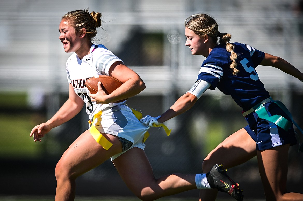 Flathead's Quinlenn Tennison (13) is tackled by Glacier's Kiera Sullivan (5) at Legends Stadium on Saturday, Sept. 10. (Casey Kreider/Daily Inter Lake)