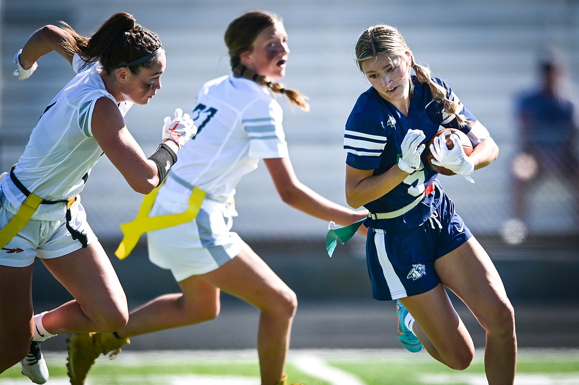 Glacier's Kiera Sullivan (5) picks up yardage after a reception against Flathead at Legends Stadium on Saturday, Sept. 10. (Casey Kreider/Daily Inter Lake)