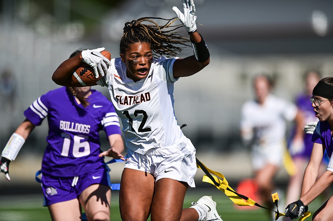 Flathead receiver Akilah Kubi (12) is tackled after a reception against Butte at Legends Stadium on Saturday, Sept. 10. (Casey Kreider/Daily Inter Lake)