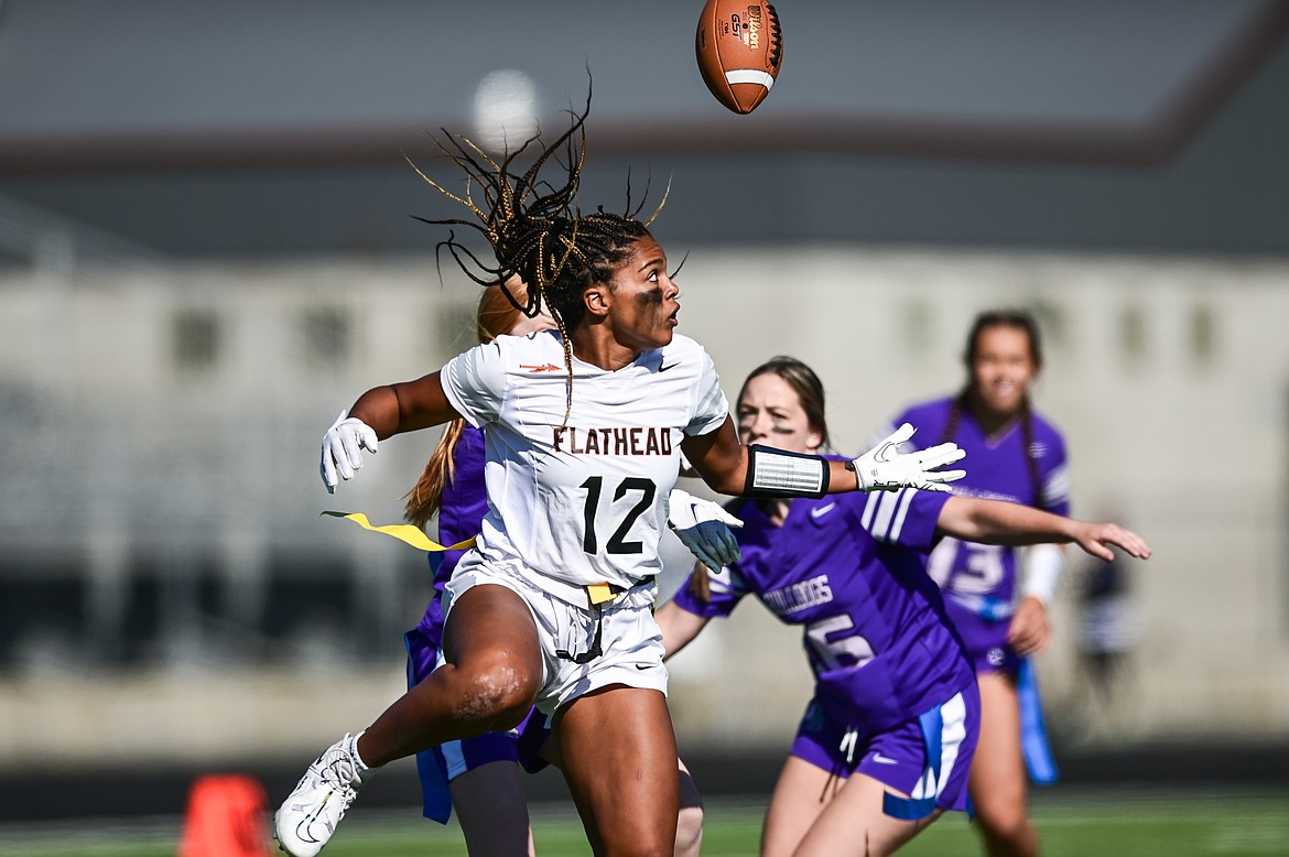 Flathead receiver Akilah Kubi (12) tips a pass into the air and makes the reception against Butte at Legends Stadium on Saturday, Sept. 10. (Casey Kreider/Daily Inter Lake)